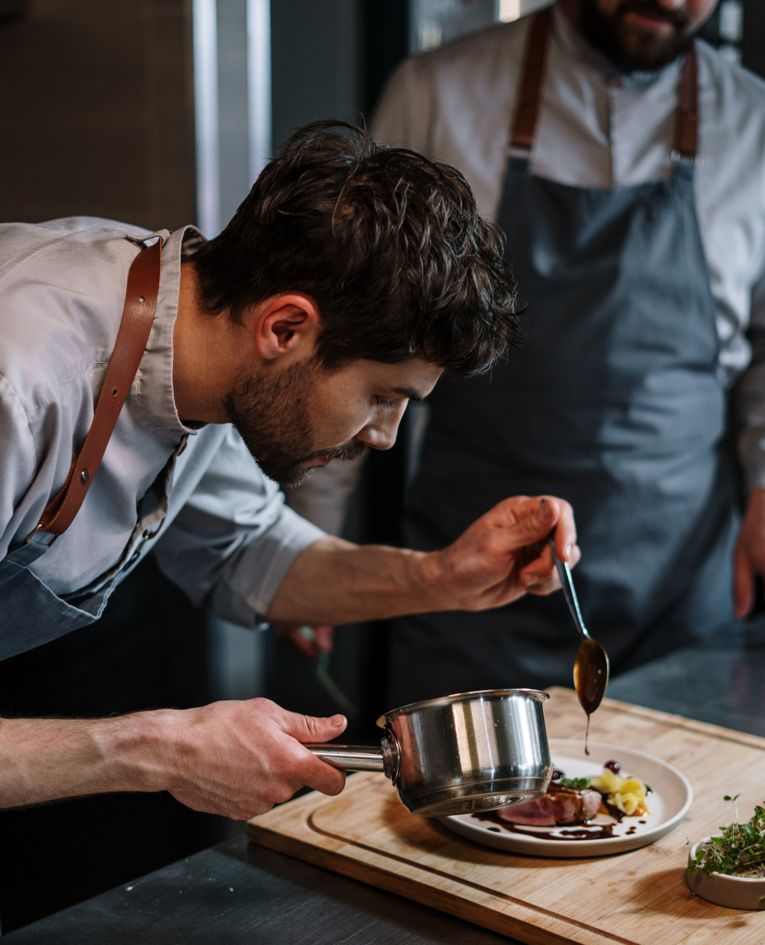 A Man Preparing Food In A Kitchen